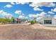 Wide shot of home with metal storage building, showcasing ample yard space at 37414 N 17Th Ave, Phoenix, AZ 85086