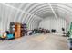 Spacious garage interior featuring high ceilings and abundant storage options, designed for maximum organization and convenience at 37414 N 17Th Ave, Phoenix, AZ 85086