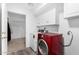 Practical laundry room with washer, dryer, and overhead storage at 37414 N 17Th Ave, Phoenix, AZ 85086