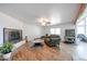 Cozy living room with wood floors, a fireplace, and lots of natural light at 37414 N 17Th Ave, Phoenix, AZ 85086