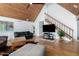 Spacious living room featuring hardwood floors, beamed ceilings, staircase and large windows at 37414 N 17Th Ave, Phoenix, AZ 85086
