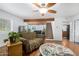 Comfortable living space featuring hardwood floors, neutral walls and a cozy sitting area at 37414 N 17Th Ave, Phoenix, AZ 85086