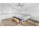Spacious main bedroom featuring a ceiling fan, carpeted floor, and a cozy bench at 37414 N 17Th Ave, Phoenix, AZ 85086