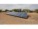 An array of solar panels situated on the property grounds for energy efficiency at 37414 N 17Th Ave, Phoenix, AZ 85086