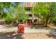 Charming building exterior with well-maintained landscaping and secure gated entry at 387 N 2Nd Ave # F2, Phoenix, AZ 85003