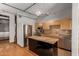 Well-lit kitchen featuring stainless steel appliances, a center island, and tile backsplash at 387 N 2Nd Ave # F2, Phoenix, AZ 85003