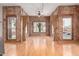 Spacious living room featuring hardwood floors, exposed brick, and abundant natural light from large windows at 387 N 2Nd Ave # F2, Phoenix, AZ 85003
