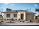 Charming single-story home featuring a neutral color palette, attached garage, and low-maintenance desert landscaping at 3986 E Gold Mountain Ave, San Tan Valley, AZ 85143