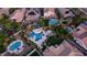Aerial view of pool and backyard with swim up bar, jacuzzi, and rock waterfall at 4281 S Iowa St, Chandler, AZ 85248