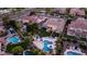 Spacious backyard with sparkling pool, patio area, trampoline, and lush landscaping with trees at 4281 S Iowa St, Chandler, AZ 85248