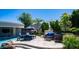 Backyard oasis featuring a pool, lounge chairs, patio furniture, outdoor kitchen, and lush landscaping at 4281 S Iowa St, Chandler, AZ 85248