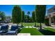 Expansive backyard featuring a lush lawn, mature trees, pavers, and a soccer net for outdoor enjoyment at 4281 S Iowa St, Chandler, AZ 85248