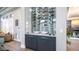 Custom wine bar featuring a tile backsplash, glass enclosure, and convenient storage cabinets at 4281 S Iowa St, Chandler, AZ 85248