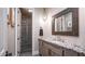 Elegant bathroom featuring a granite countertop vanity and a view of the walk-in shower at 4281 S Iowa St, Chandler, AZ 85248