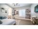 Bright bedroom with natural light, a collage wall, and a cozy rug at 4281 S Iowa St, Chandler, AZ 85248