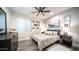 Inviting bedroom with a plush bed, accent decor, neutral palette, and lots of natural light at 4281 S Iowa St, Chandler, AZ 85248
