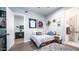 Cozy bedroom with a gray rug and decor, and unique wall art at 4281 S Iowa St, Chandler, AZ 85248