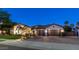 Exterior view of a beautiful house showcasing a well-manicured lawn, and three-car garage at 4281 S Iowa St, Chandler, AZ 85248