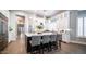 Bright kitchen featuring a large island with seating, white cabinets, and stainless appliances at 4281 S Iowa St, Chandler, AZ 85248
