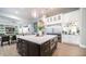 Open concept kitchen boasting a large island, stainless steel appliances, and seamless flow to the living space at 4281 S Iowa St, Chandler, AZ 85248