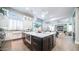 Expansive kitchen featuring a large island with white marble countertops, a prep sink, and stainless steel appliances at 4281 S Iowa St, Chandler, AZ 85248