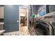 Laundry room with washer, dryer, laundry-themed decor, and convenient access to the walk-in closet at 4281 S Iowa St, Chandler, AZ 85248