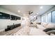 Contemporary living room with an expansive sectional, sleek entertainment center, and modern fixtures at 4281 S Iowa St, Chandler, AZ 85248