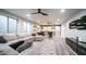 Open-concept living room with a sectional sofa, a stylish rug, and a wet bar for entertaining at 4281 S Iowa St, Chandler, AZ 85248