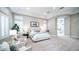 Spacious main bedroom with tray ceiling, sitting area, and ensuite access at 4281 S Iowa St, Chandler, AZ 85248