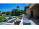 Well-appointed outdoor kitchen and lounge area with comfortable seating and a lush lawn at 4281 S Iowa St, Chandler, AZ 85248