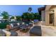Outdoor patio has comfortable seating with a grill and manicured lawn for relaxation and entertainment at 4281 S Iowa St, Chandler, AZ 85248