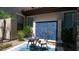 Private patio featuring a blue mosaic water feature and a cozy outdoor seating area at 4281 S Iowa St, Chandler, AZ 85248