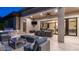 Outdoor patio features a grill, dining area, sitting area, and a built-in television for outdoor enjoyment at 4281 S Iowa St, Chandler, AZ 85248