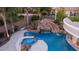 Resort-style pool has a water slide, waterfall, and spa surrounded by well-manicured landscaping at 4281 S Iowa St, Chandler, AZ 85248