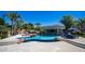 Sprawling pool with swim up bar, jacuzzi, and rock waterfall features for ultimate outdoor entertainment at 4281 S Iowa St, Chandler, AZ 85248