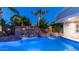 Resort-style pool with rock waterfall, waterslide, and lush landscaping, perfect for outdoor enjoyment and relaxation at 4281 S Iowa St, Chandler, AZ 85248