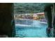 Waterfall view of the stunning pool area with integrated bar and resort style amenities at 4281 S Iowa St, Chandler, AZ 85248