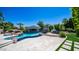 Outdoor pool and bar area with mature landscaping, waterfalls, and luxurious poolside seating at 4281 S Iowa St, Chandler, AZ 85248