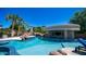 Lush outdoor pool, jacuzzi, and integrated bar area with rock waterfall feature at 4281 S Iowa St, Chandler, AZ 85248