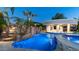 Beautiful pool with rock waterfall feature, swim up bar, and jacuzzi, perfect for relaxation and entertainment at 4281 S Iowa St, Chandler, AZ 85248