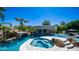 Stunning pool with a swim-up bar, waterfall feature, and a spa surrounded by lush landscaping at 4281 S Iowa St, Chandler, AZ 85248