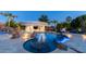Beautifully landscaped pool with rock waterfall, spa, and swim-up bar, perfect for outdoor relaxation and enjoyment at 4281 S Iowa St, Chandler, AZ 85248