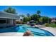 Resort-style pool with a swim-up bar, lounge seating, and meticulous landscaping at 4281 S Iowa St, Chandler, AZ 85248
