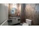 Chic powder room with metallic wallpaper and a decorative vanity at 4281 S Iowa St, Chandler, AZ 85248