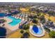 Expansive community with pools, a splash pad, playground, walking paths, and common areas for residents at 43344 W Oster Dr, Maricopa, AZ 85138