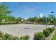 Full-sized community basketball court with hoops, and court lines at 43344 W Oster Dr, Maricopa, AZ 85138