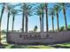 Community entrance with lush landscaping and sign reading 'Villages at Rancho El Dorado' at 43344 W Oster Dr, Maricopa, AZ 85138