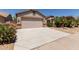 Charming single-Gathering home with desert landscaping, covered entry, and a two-car garage at 43344 W Oster Dr, Maricopa, AZ 85138