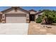 Charming single-Gathering home with desert landscaping, covered entry, and a two-car garage at 43344 W Oster Dr, Maricopa, AZ 85138
