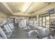 Well-equipped fitness center with treadmills, weight machines, and ceiling fans for a comfortable workout at 43344 W Oster Dr, Maricopa, AZ 85138